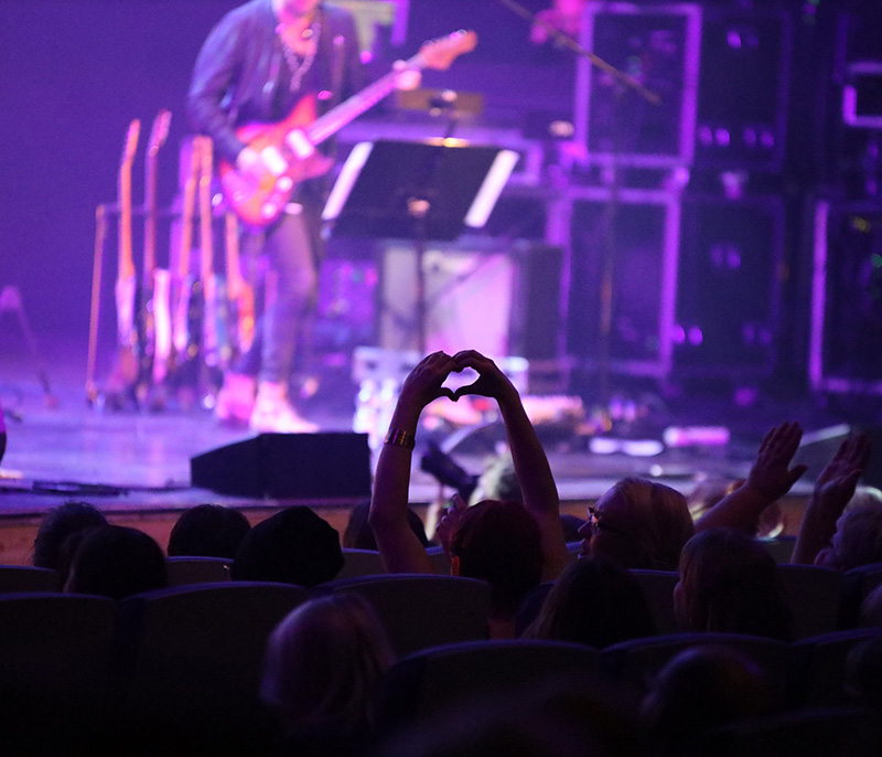 A concert organized in Tampere Hall, where the band plays on stage.