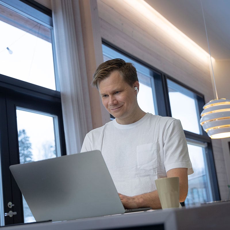 Solteq's product development engineer works on a laptop