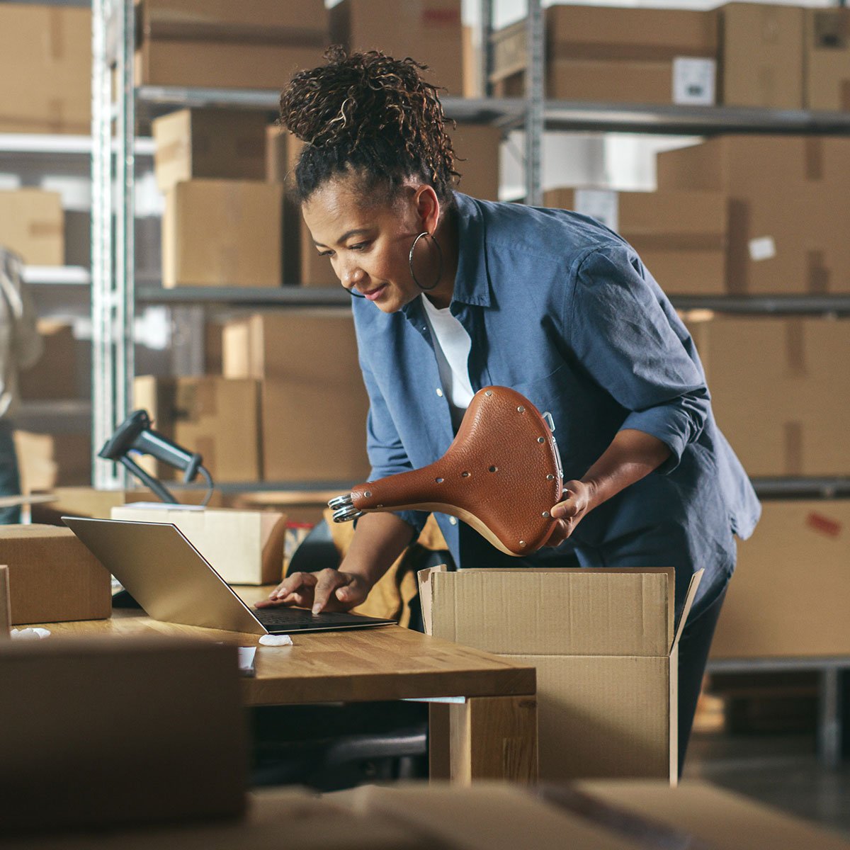 Woman checking product information from DynamicWeb's PIM module