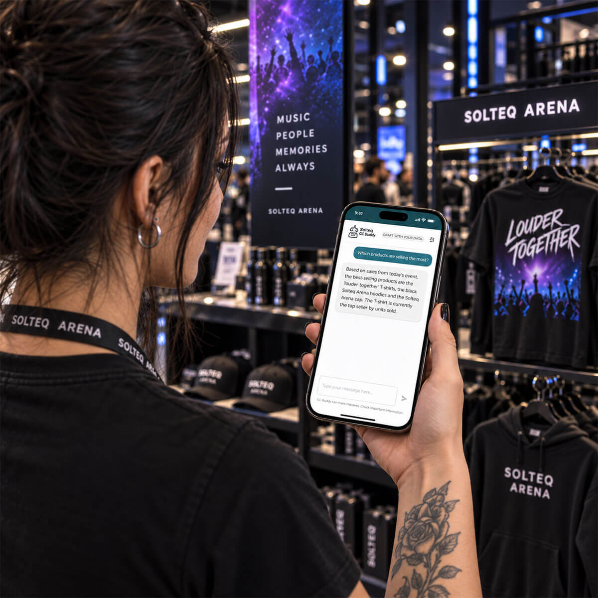 Merchandise saleswoman at an event arena store is asking an AI-powered Buddy on her mobile, 'Which products are selling the most?'
