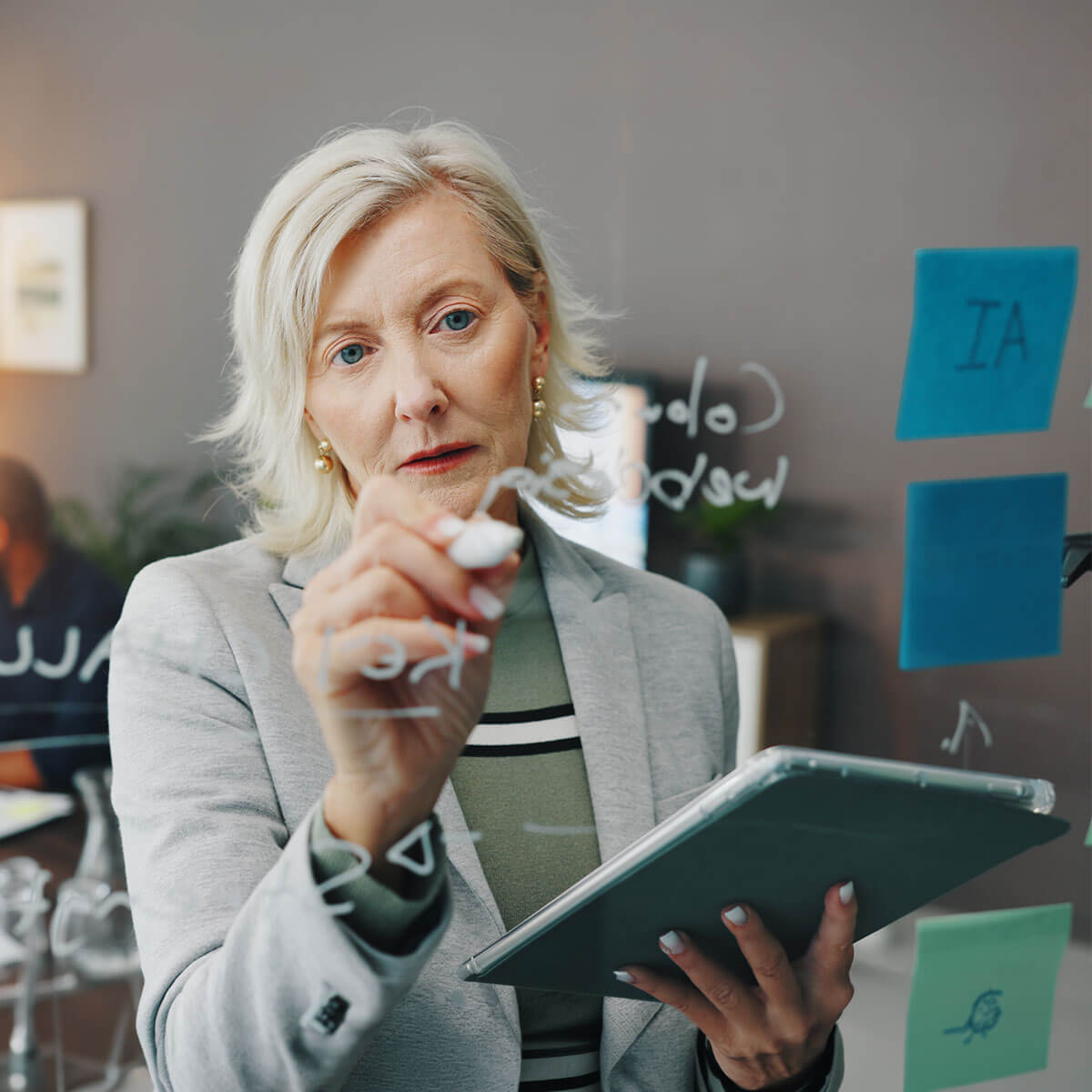 Businesswoman planning digital strategy, aligning systems, data, and customer journeys