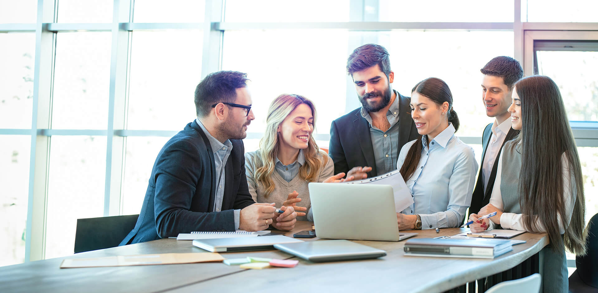 Consultants engaging in a project discussion with the client around the table.