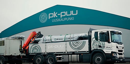 A PK-Puu truck loading timber at the company's warehouse in Uusikaupunki, Finland.