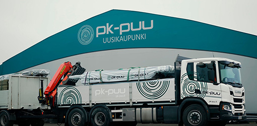 A PK-Puu truck loading timber at the company's warehouse in Uusikaupunki, Finland.