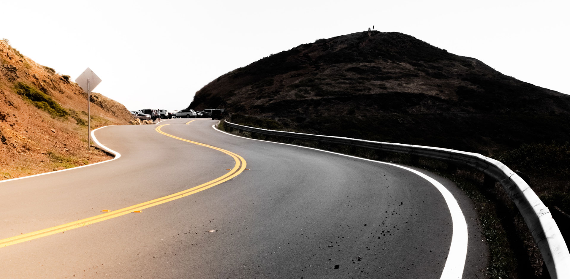 The winding road rises up in the mountains.