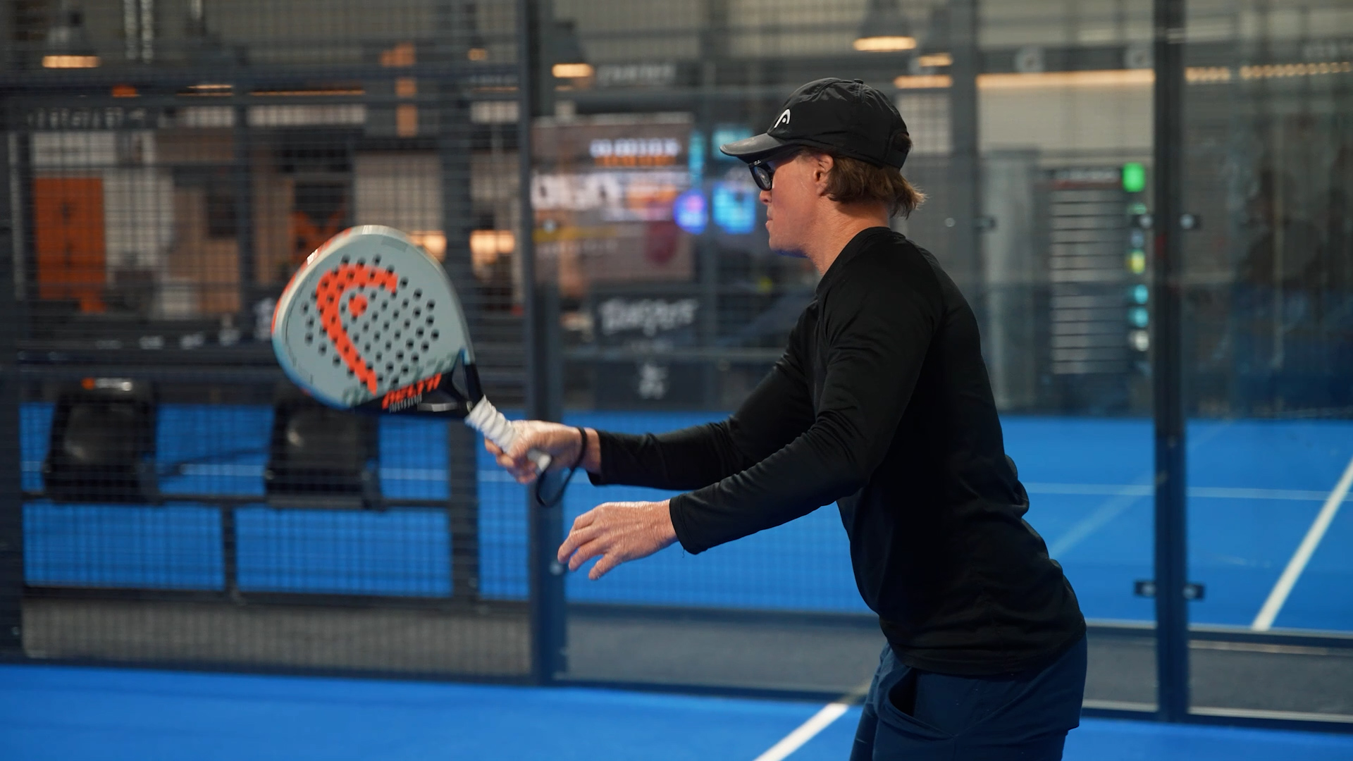 Man playing padel.