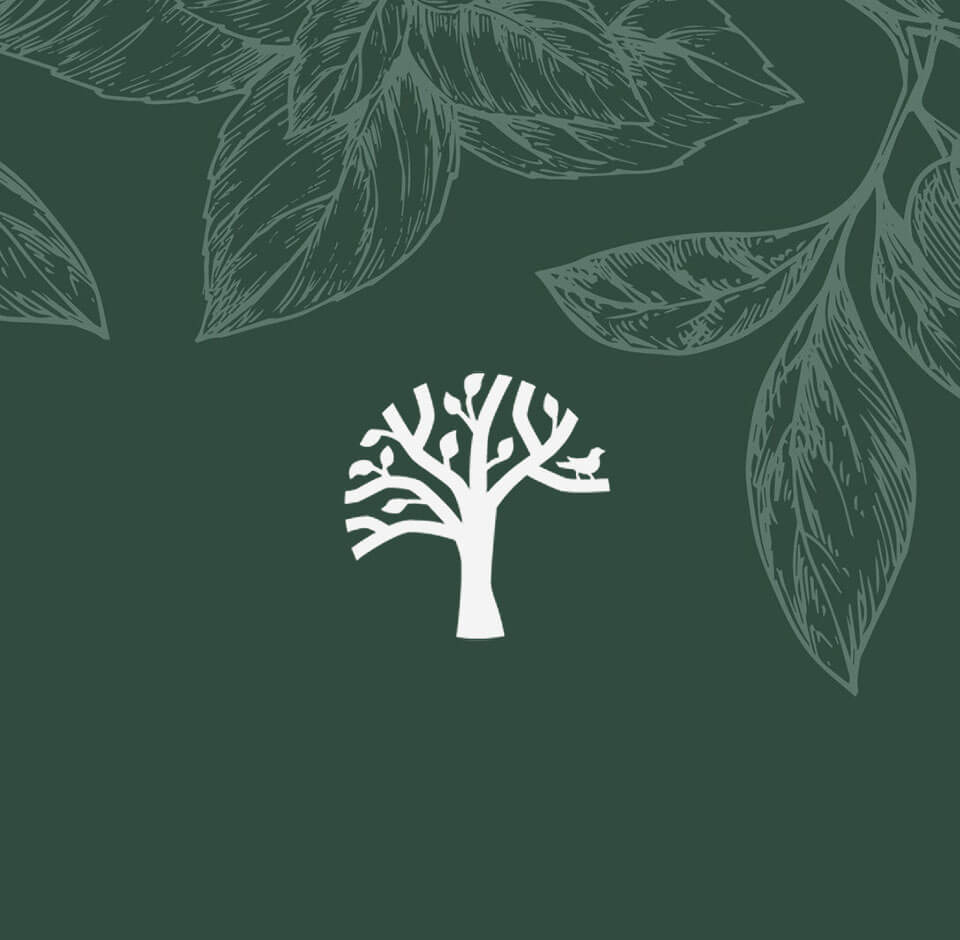 Tree silhouette against green leaves background