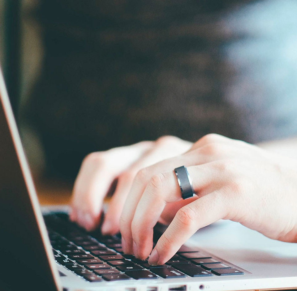 SAXO - Woman's hand on a laptop keyboard