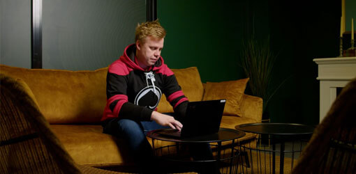 Niklas Ikonen, Business Director, HC Porin Ässät sitting on a couch