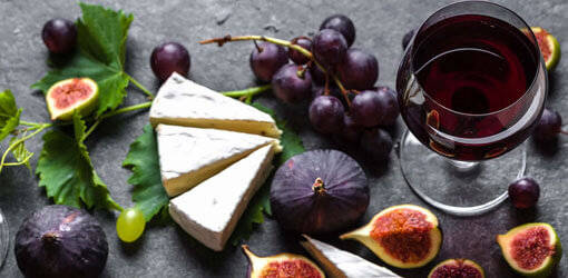 Cheese, wine and figs on the table