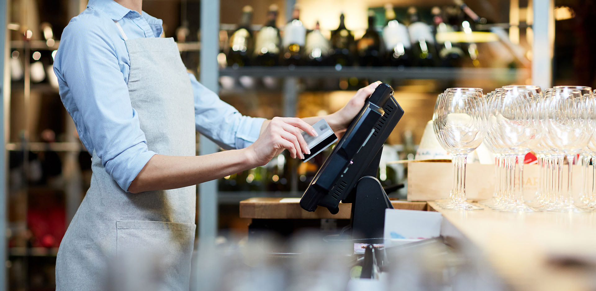 A restaurant worker using POS system.