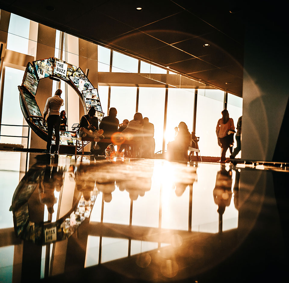 Solteq Utilities Customer and Self-service - People on a lobby of a modern electric company