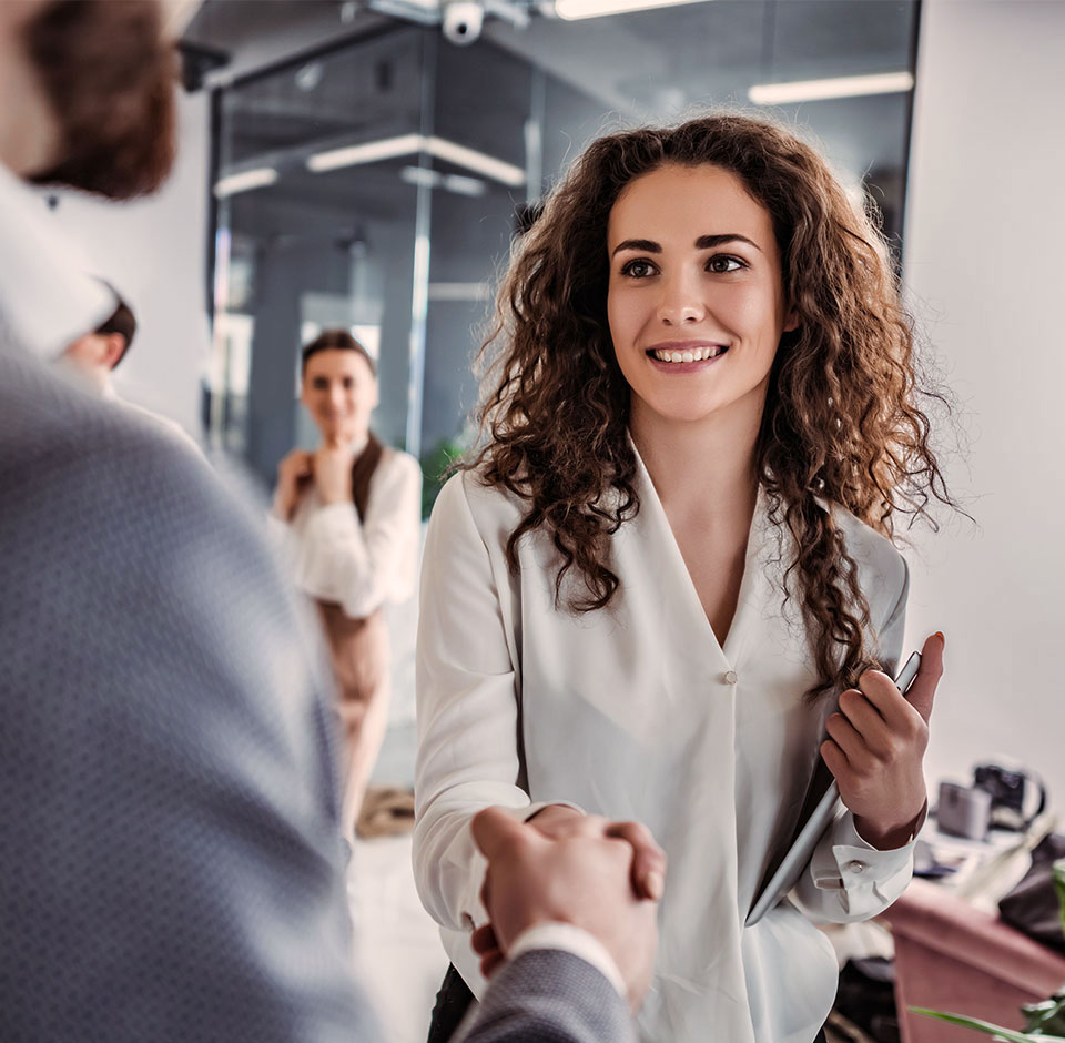 A satisfied customer shakes hands with customer information system solution supplier