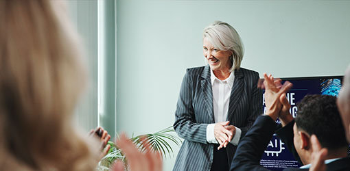 Woman presenting digital strategy, representing unified systems and connected customer experiences
