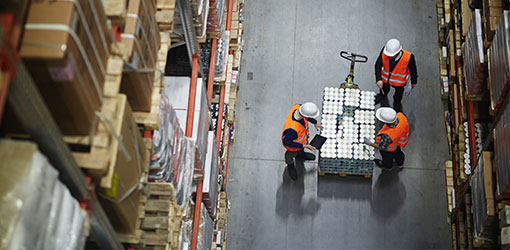 Order Management - Three men at retail storage sorting out webstore order management
